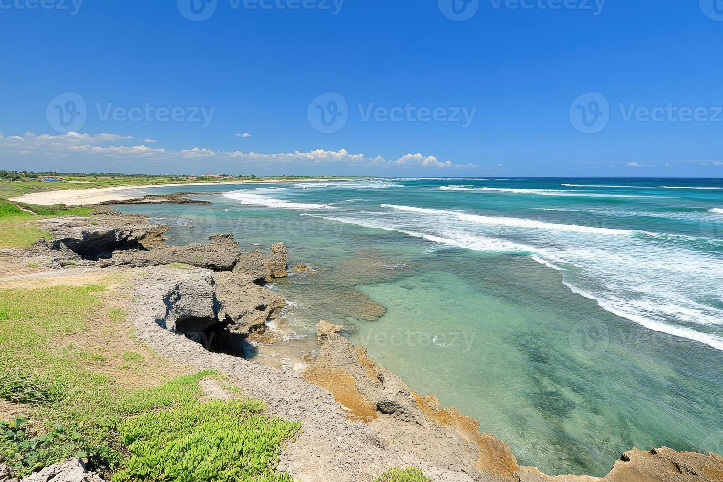 Coastal scene of turquoise water meeting land photo