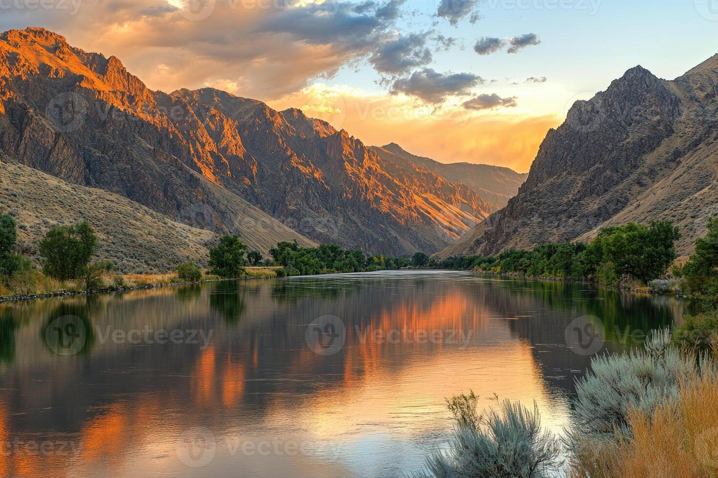 Serene river valley at sunset photo