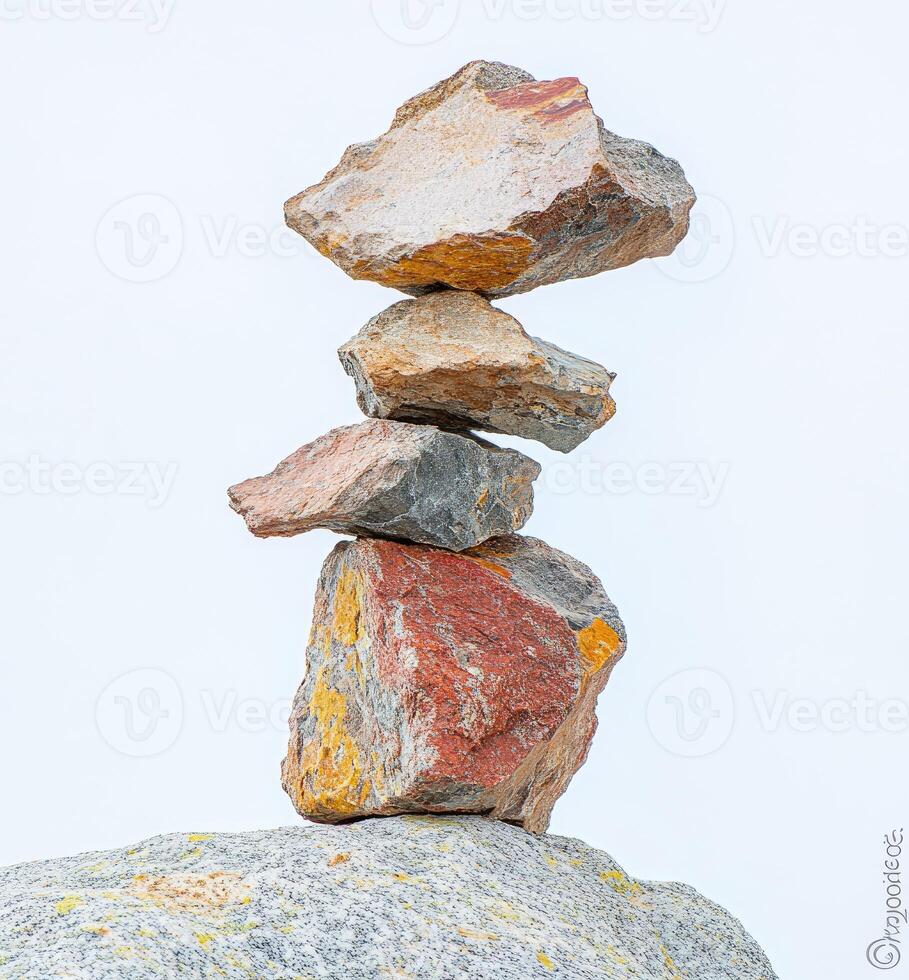 Stacked stones balancing precariously photo