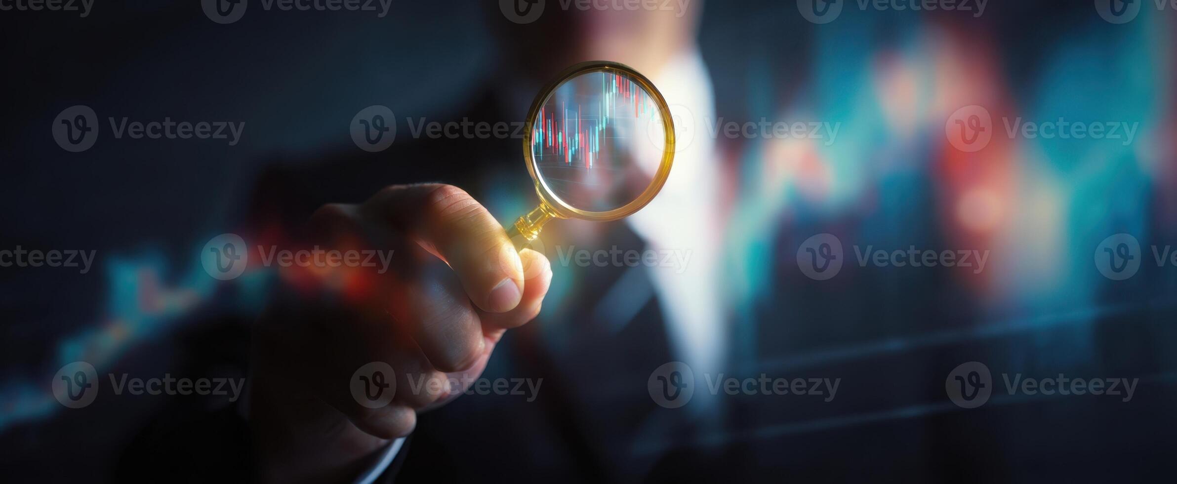 The magnifying glass revealing financial data trends in a business environment. photo