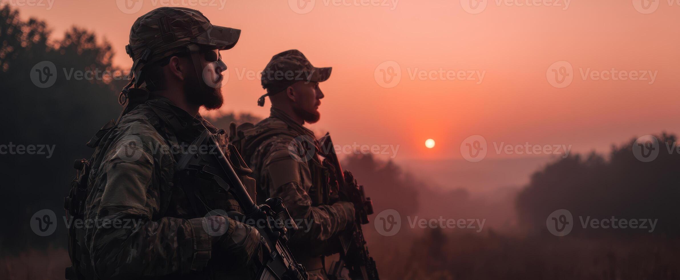 The soldiers standing guard at sunrise in a serene landscape. photo