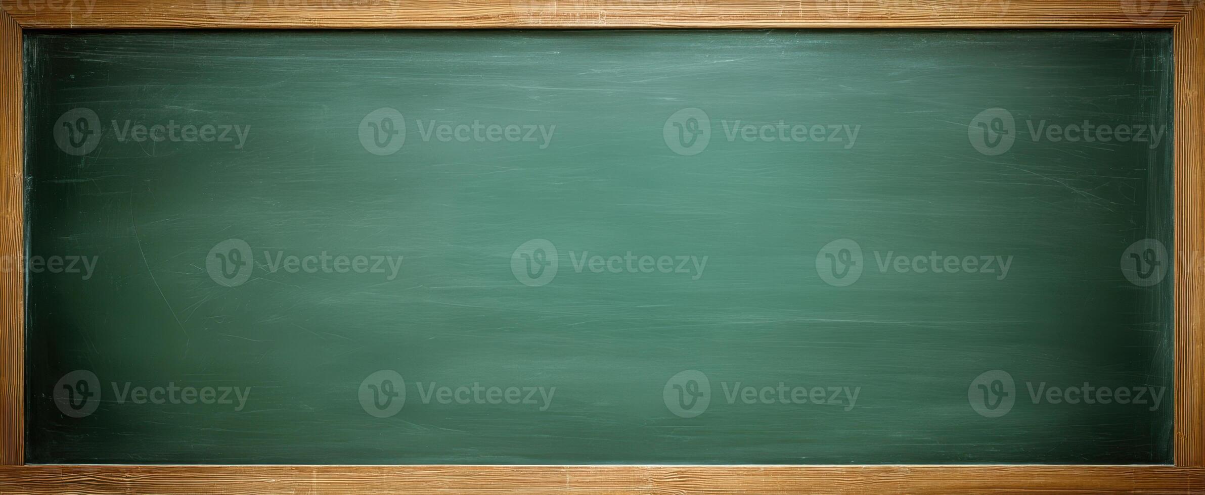 A blackboard with a wooden frame and chalk on it photo