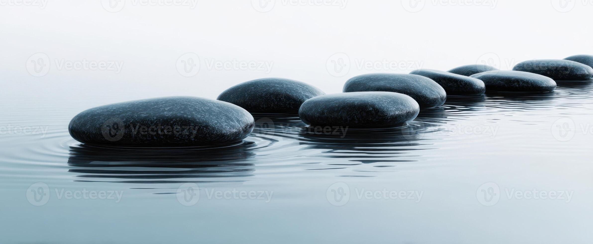 The serene arrangement of smooth stones on tranquil water surface. photo