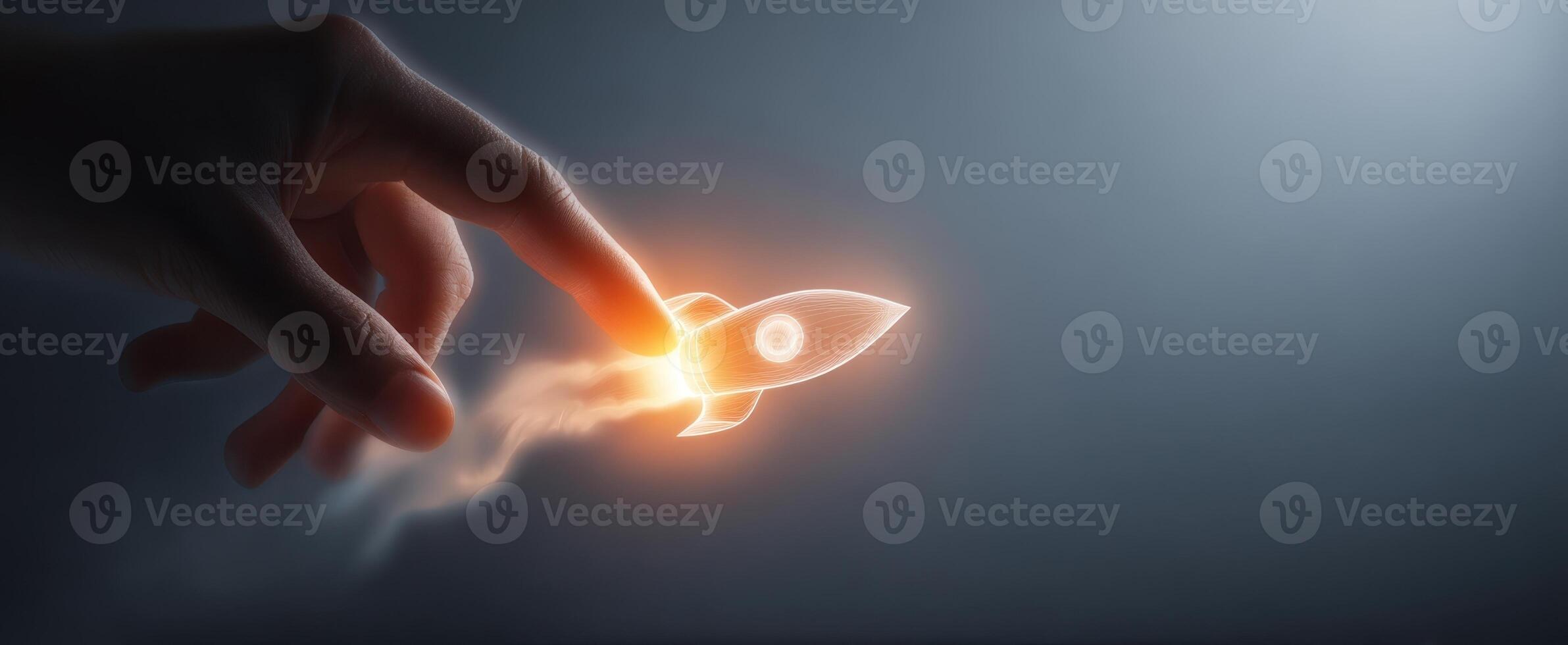 The glowing rocket being launched from a hand, representing innovation and creativity. photo