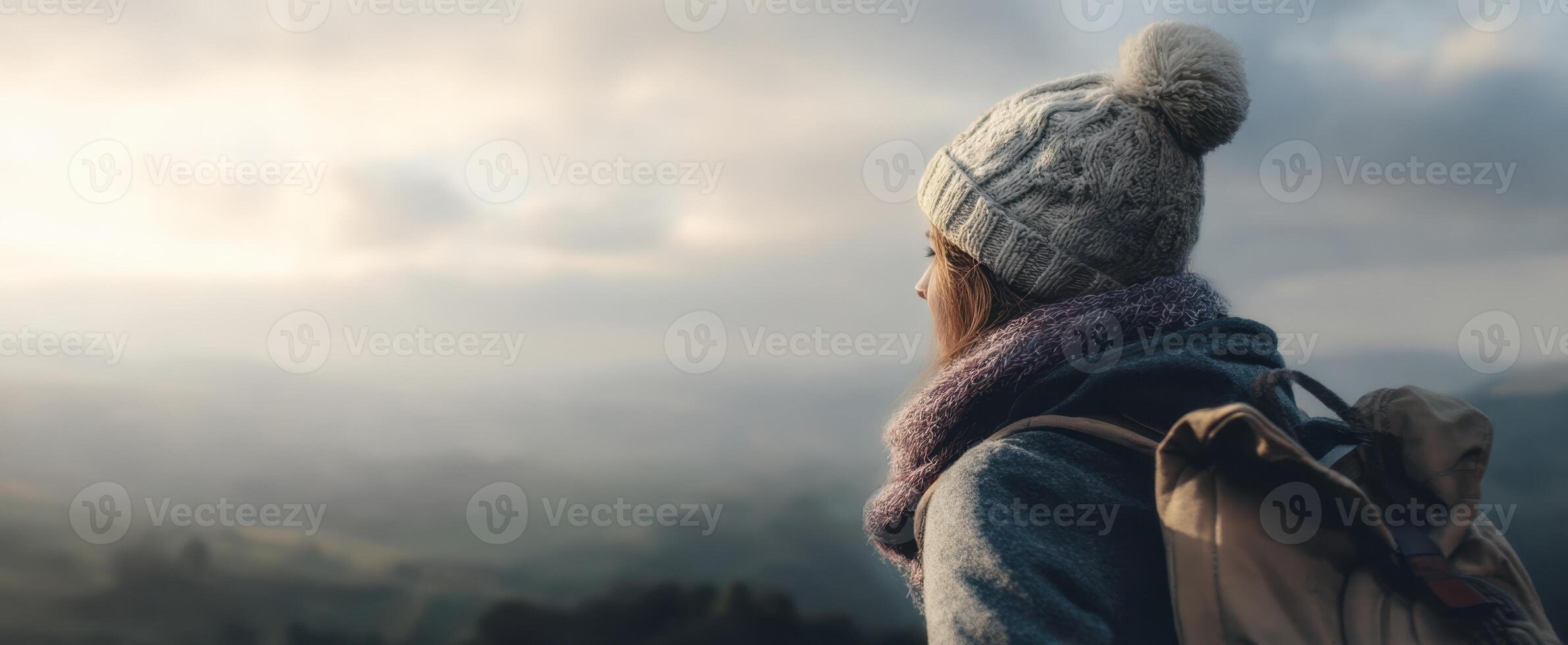 The traveler enjoying a scenic view from a mountain top. photo