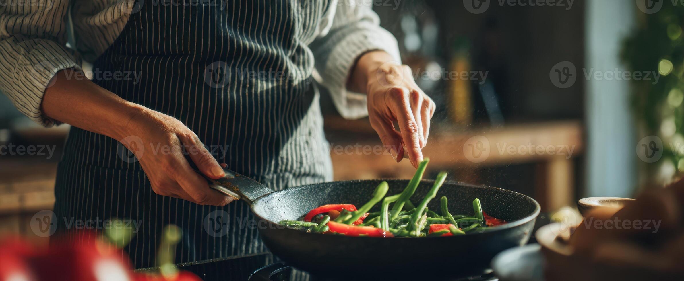 The Chef Stirring Fresh Vegetables in a Modern Kitchen Setting photo
