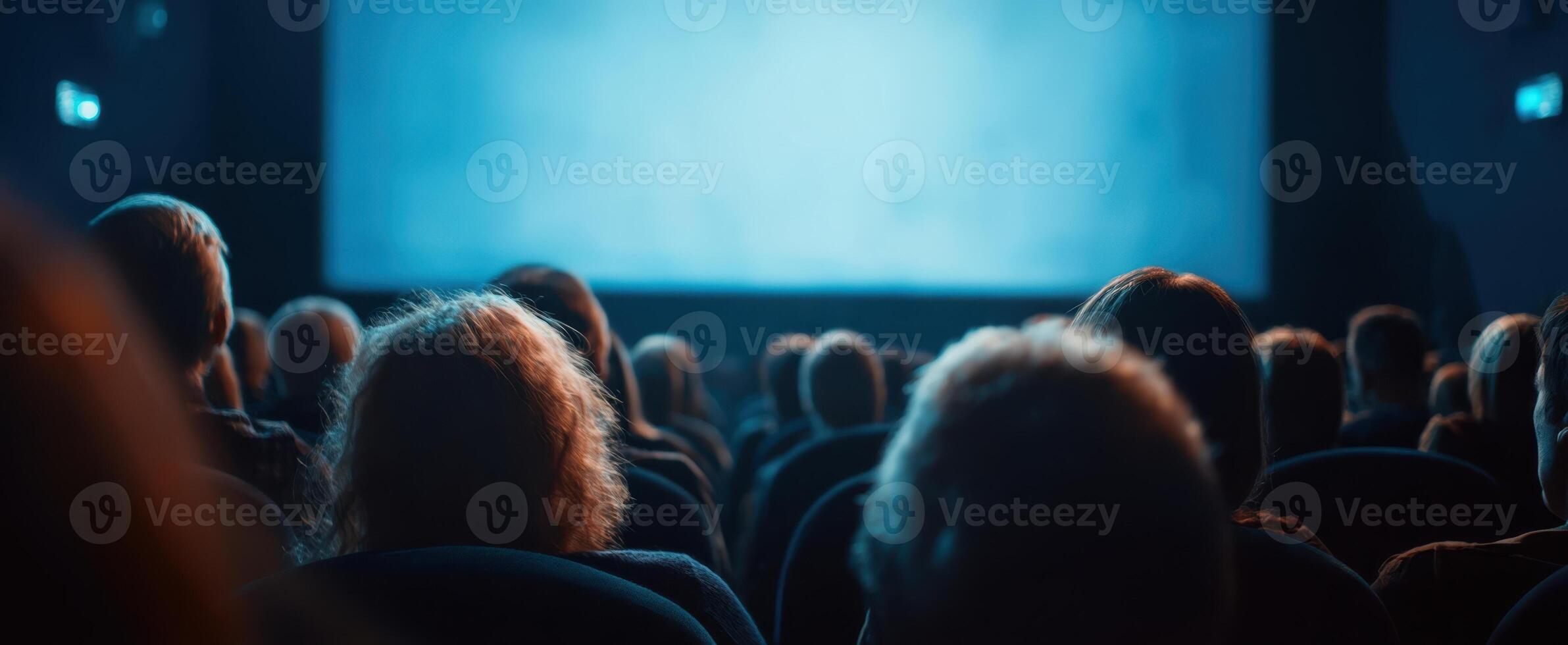 The captivating scene of an audience immersed in a cinematic experience. photo