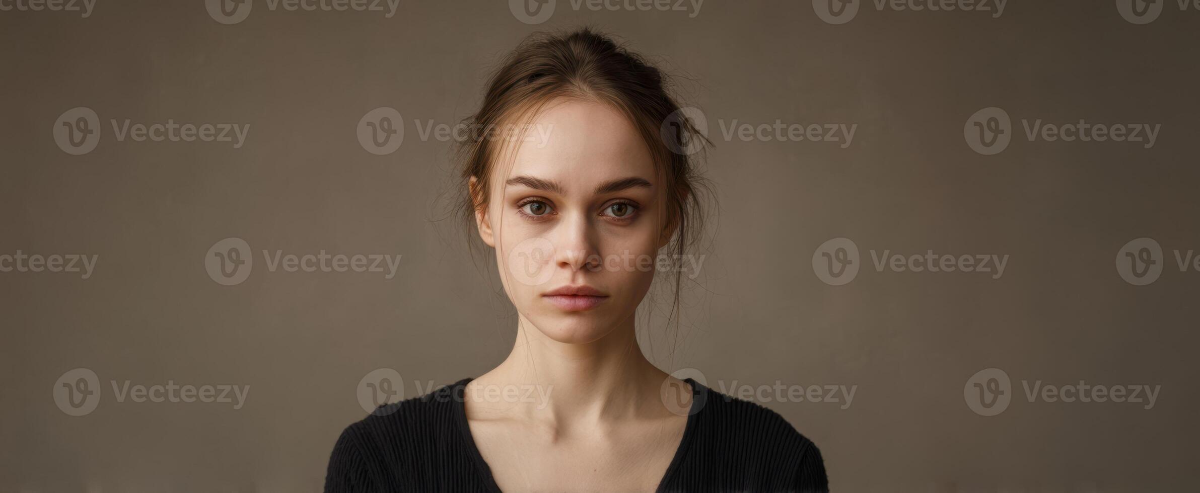 The Introspective Woman with Captivating Eyes in Studio Lighting photo