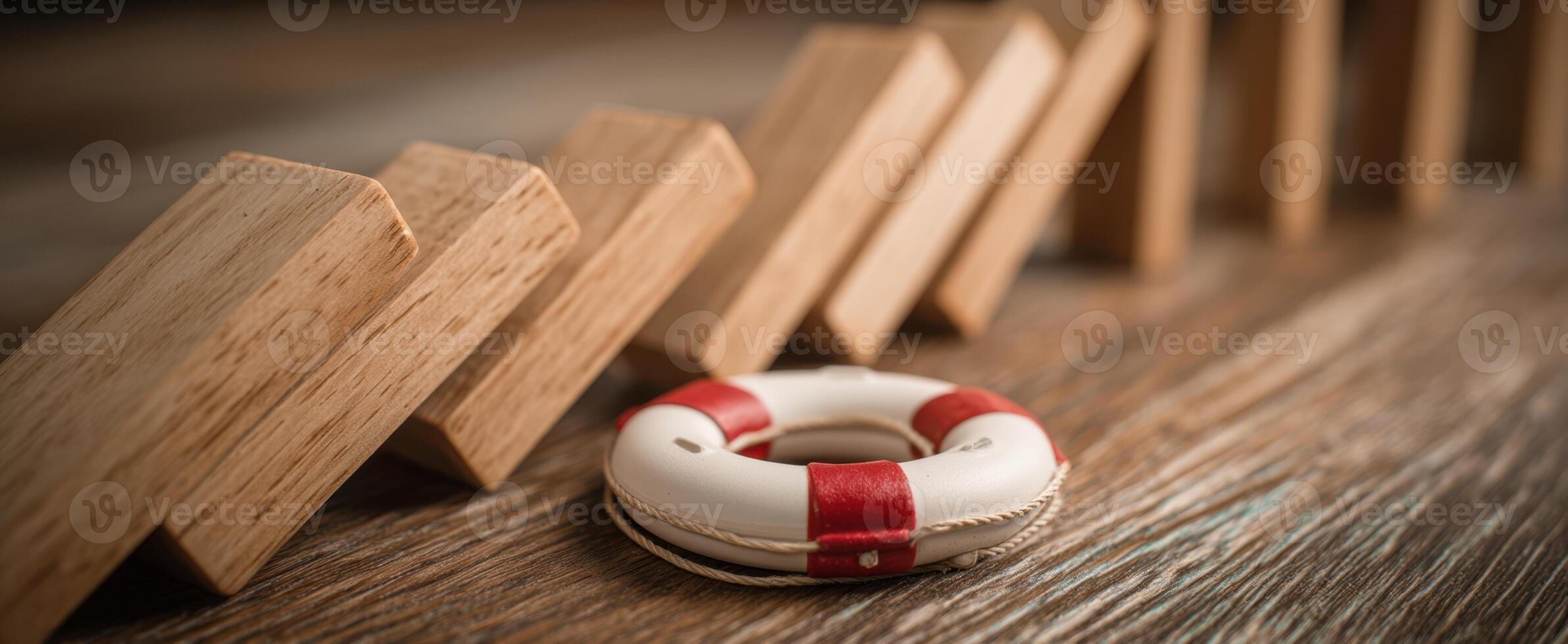 The life buoy and wooden blocks representing safety and stability concepts. photo