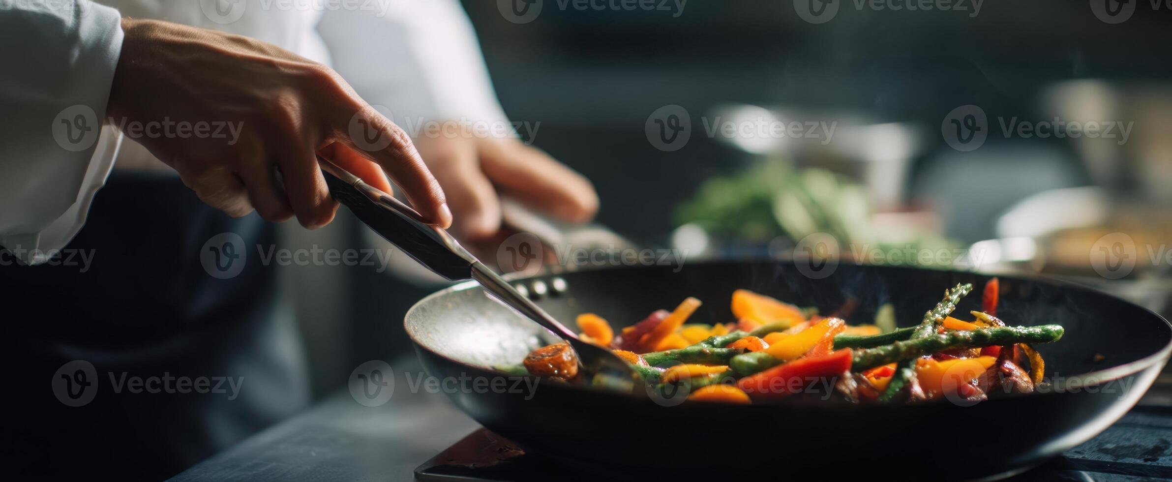 The vibrant chef skillfully stir-frying colorful vegetables in a professional kitchen. photo