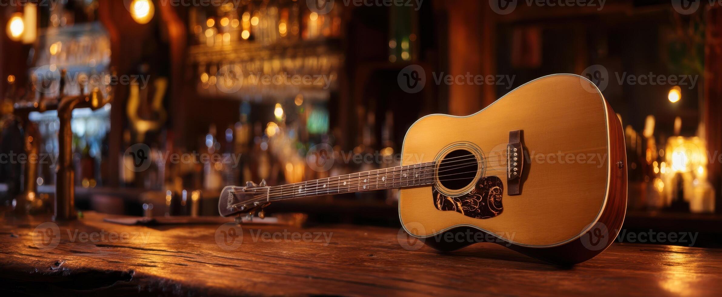 The acoustic guitar resting on a wooden bar in a cozy pub setting. photo