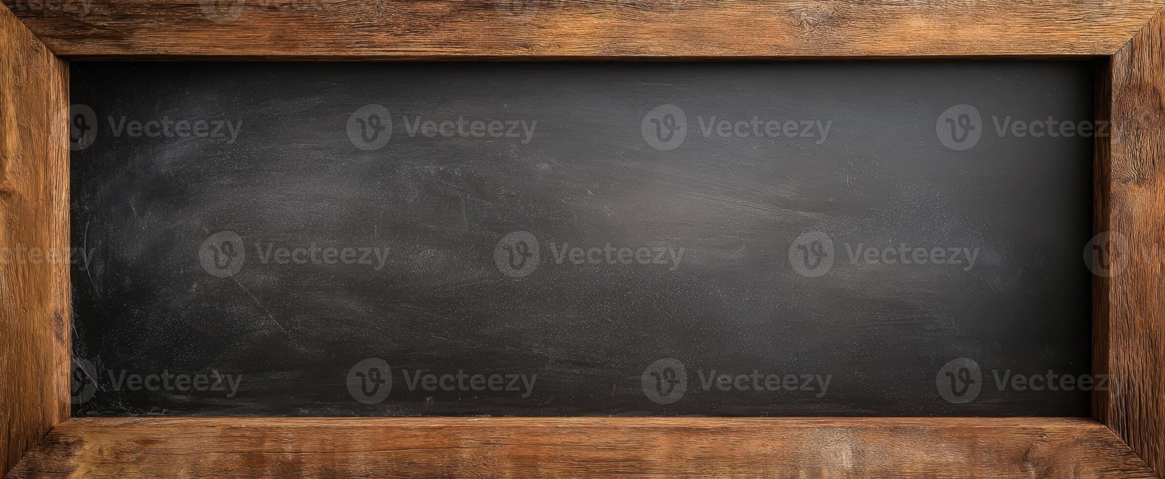 The rustic wooden frame surrounding a clean chalkboard surface for messages. photo