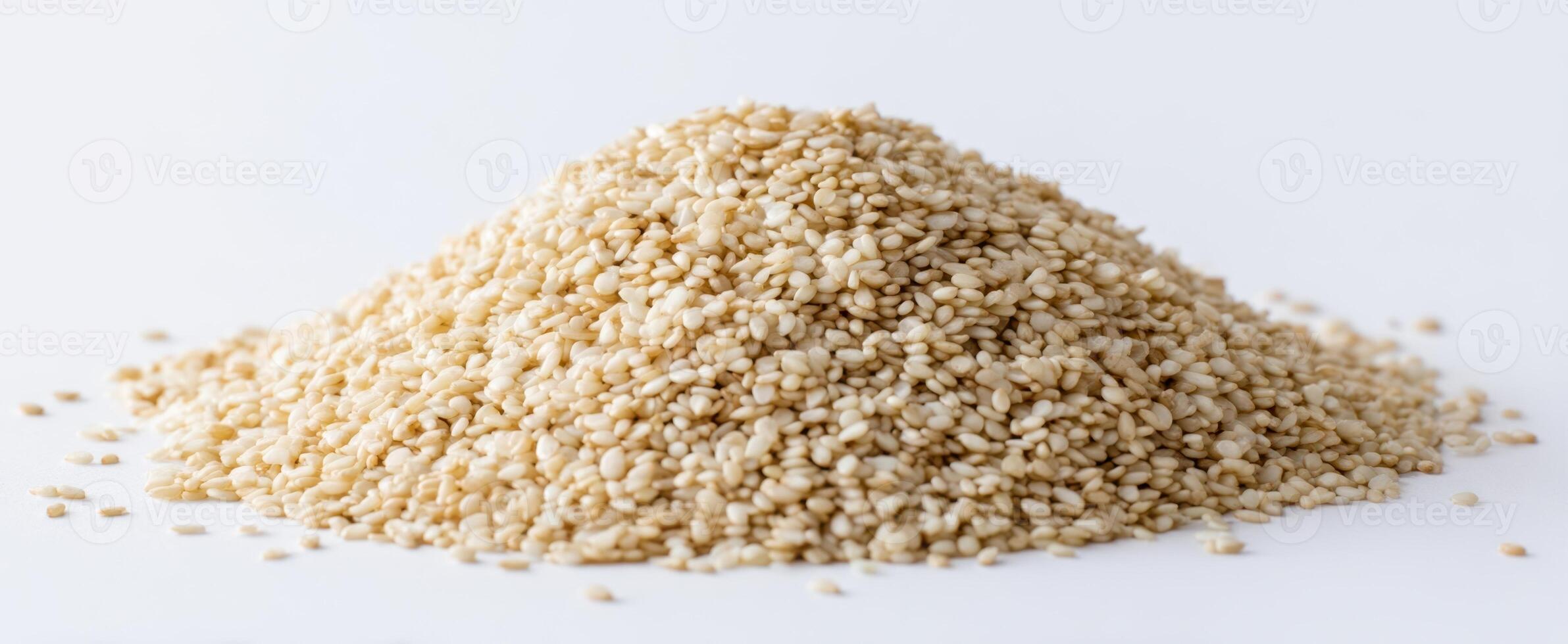 The pile of wholesome sesame seeds on a clean white background. photo