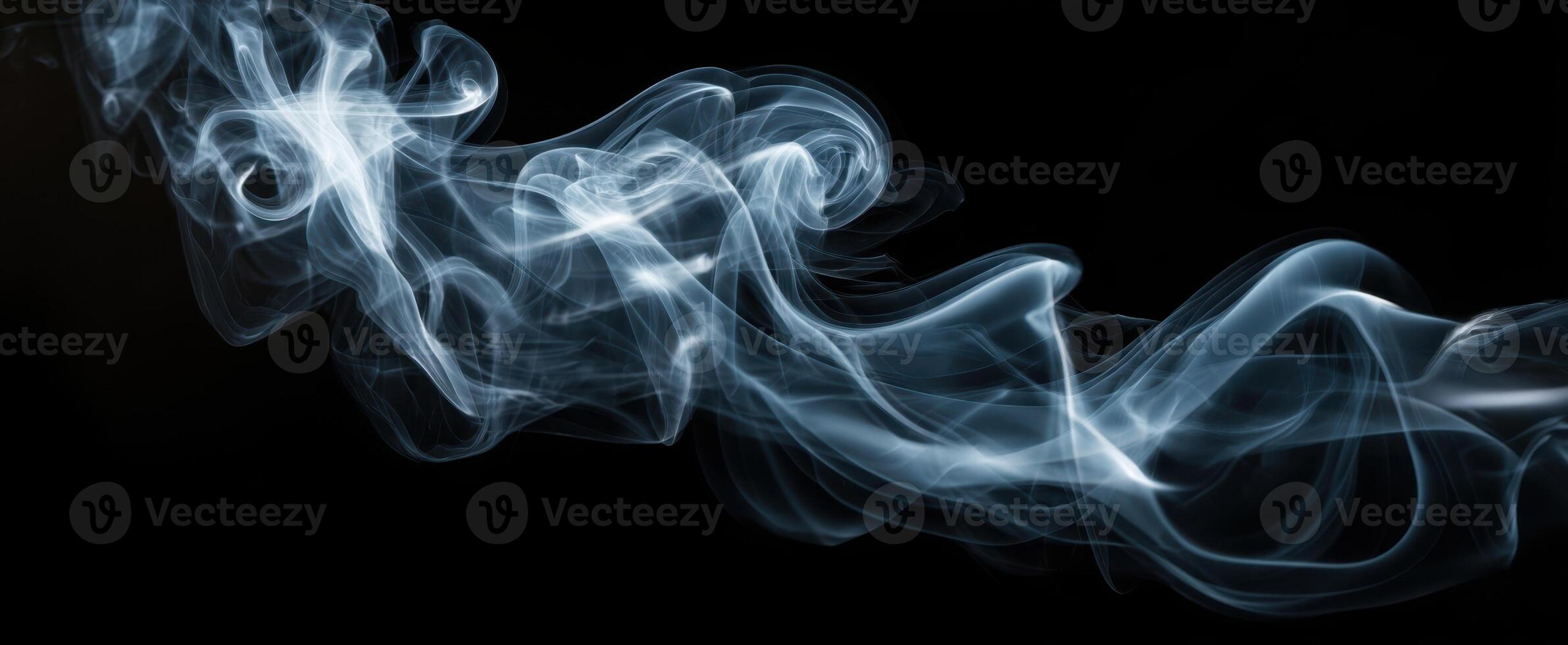 The ethereal dance of smoke against a dark background creating mesmerizing patterns. photo