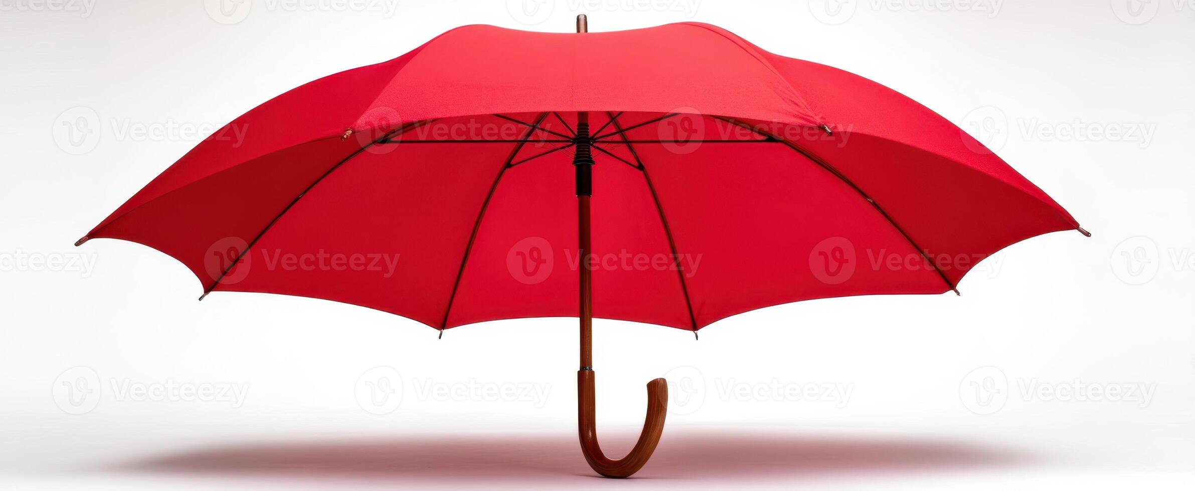 The elegant red umbrella stands proudly against a minimalist backdrop. photo
