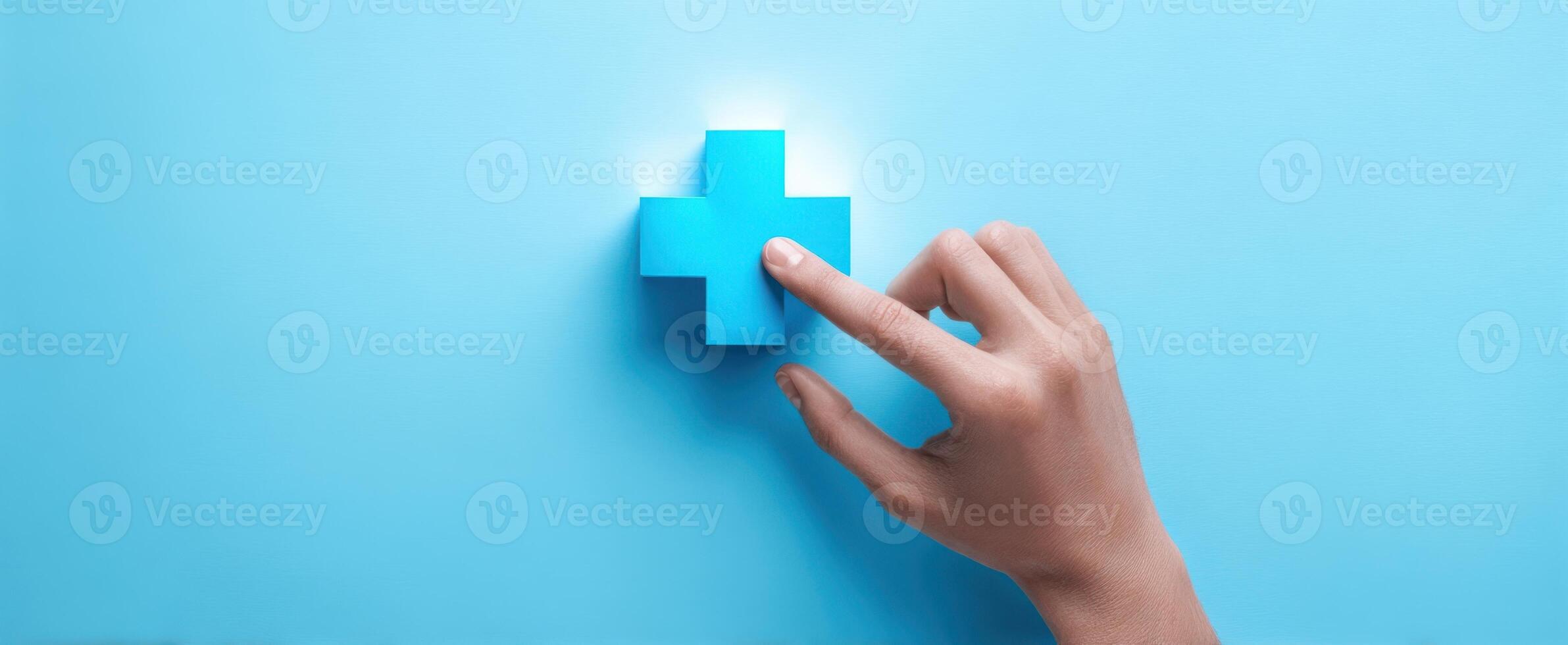 The hand interacting with a blue medical plus symbol on a vibrant background. photo