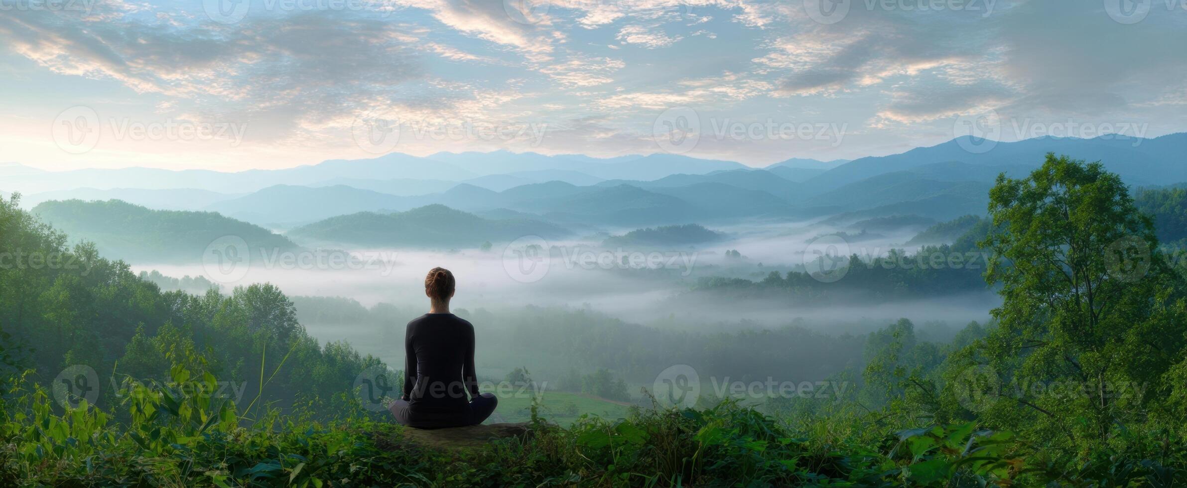 The serene meditation experience amidst the breathtaking mountain landscape. photo
