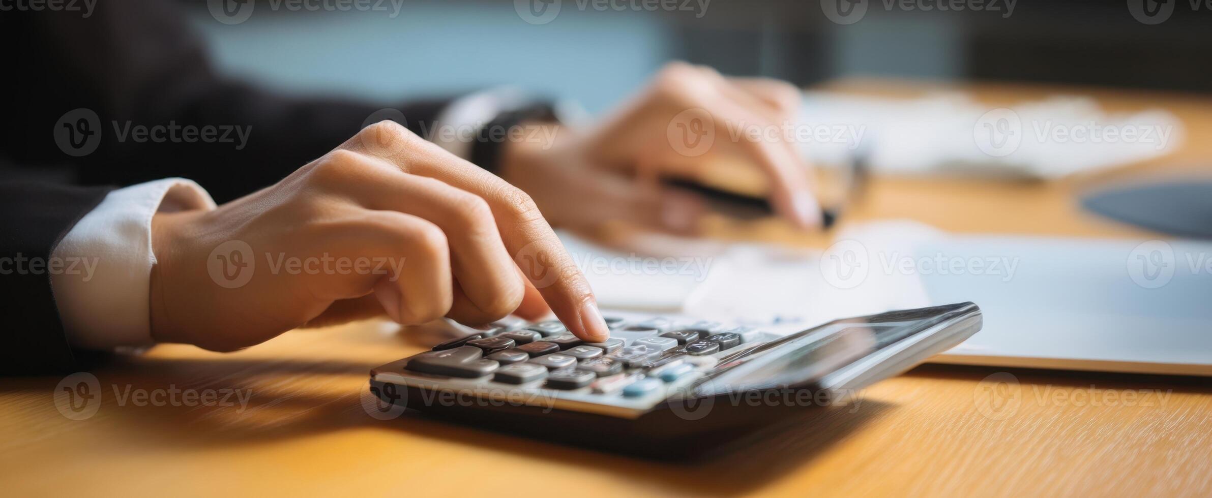 The calculator in use for detailed financial analysis at an office setting. photo