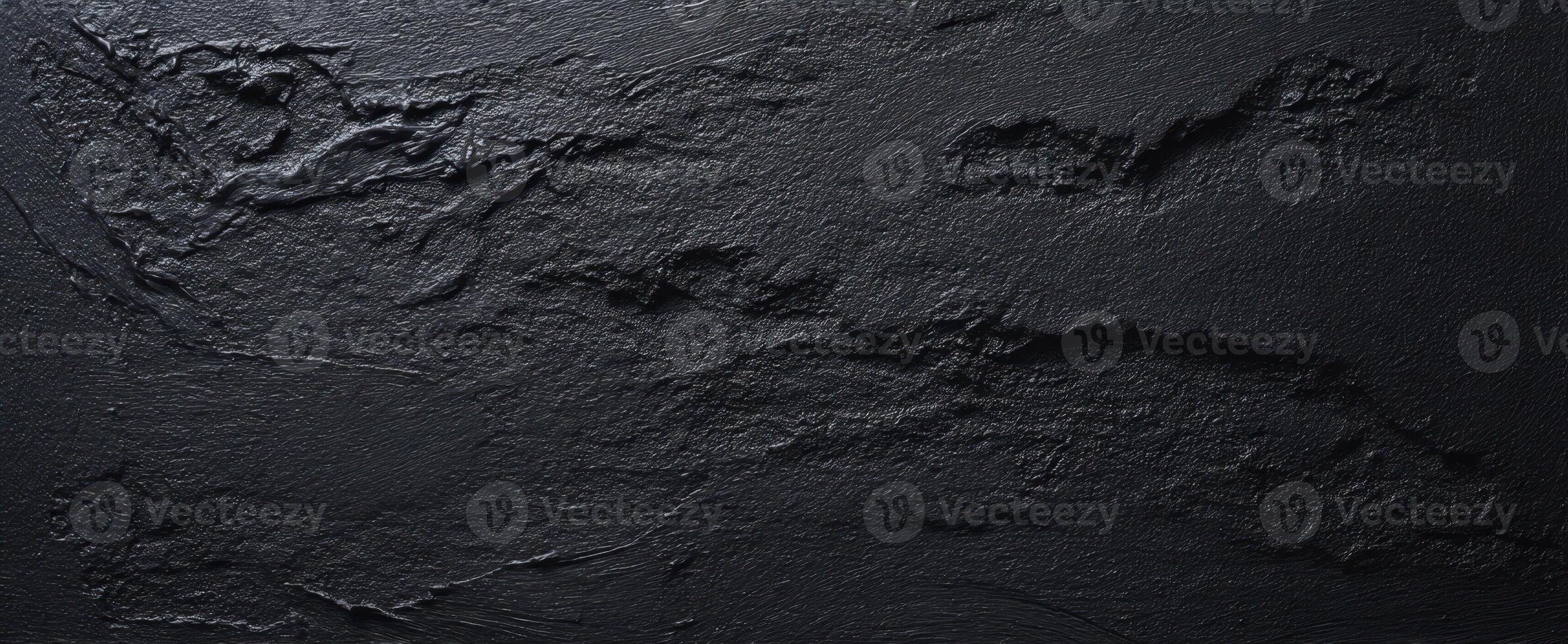 The textured black surface with abstract patterns and modern elegance. photo