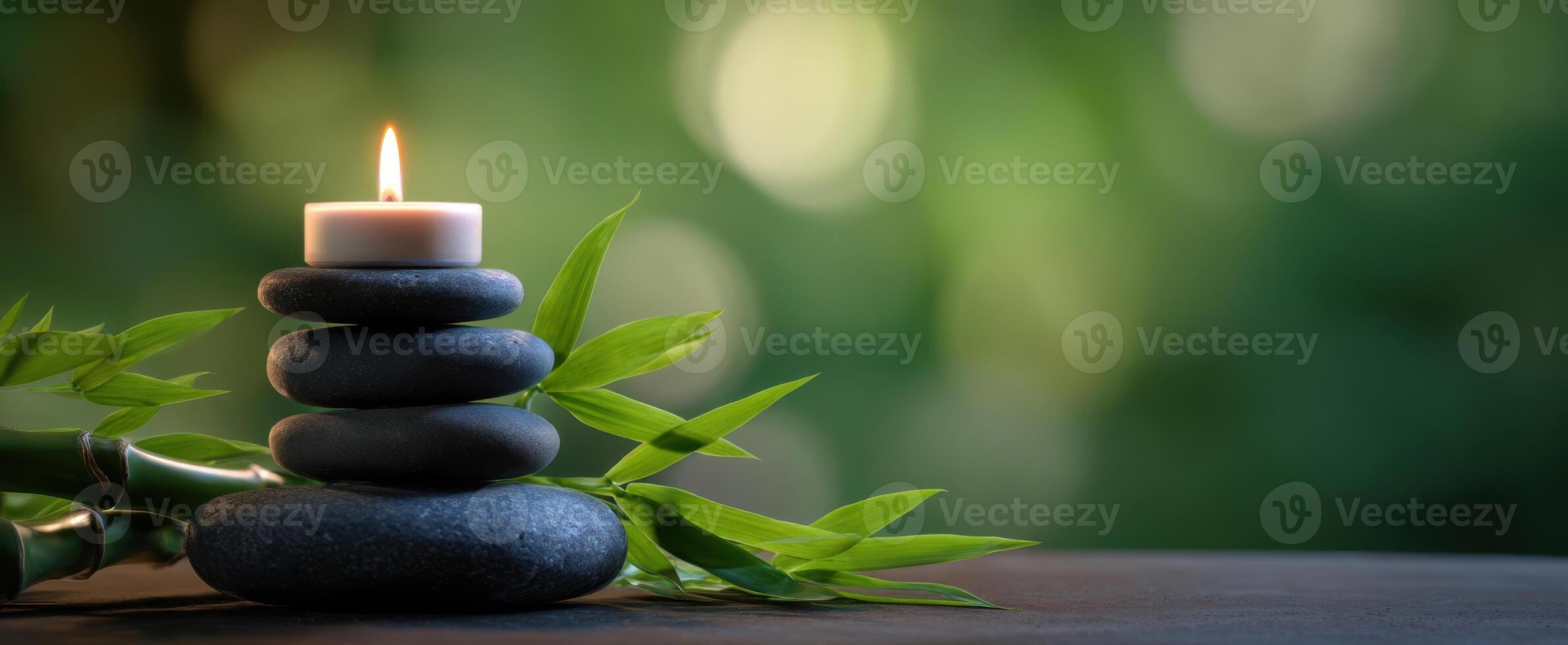 The serene composition of stones, bamboo, and candlelight for relaxation. photo