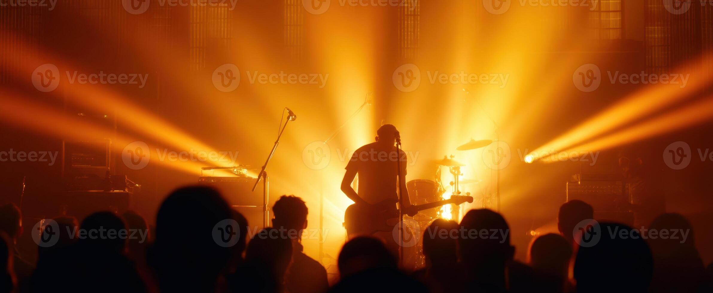 The musician captivating the audience with vibrant lights and energetic performance. photo