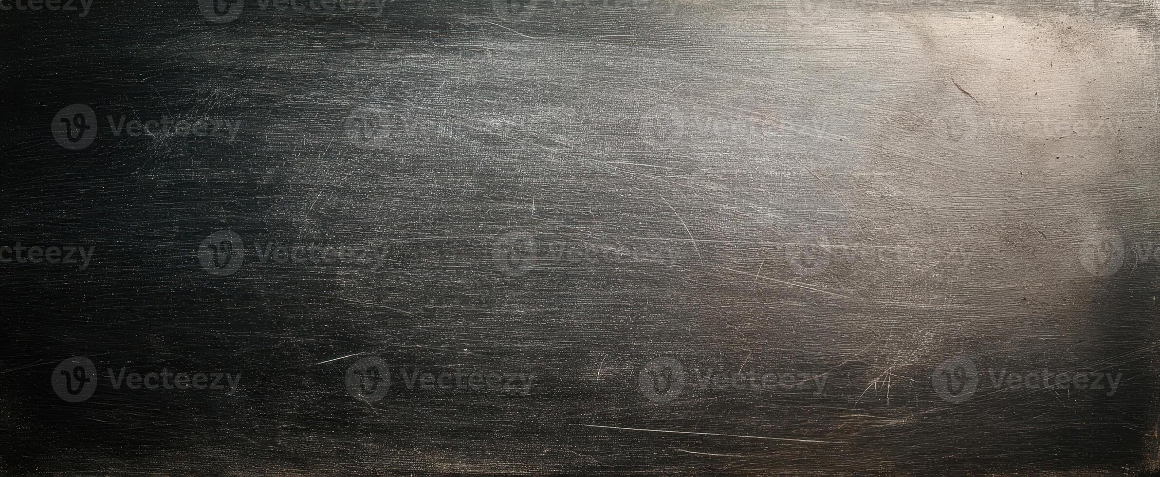 The textured metallic surface with scratches and a dark gradient. photo