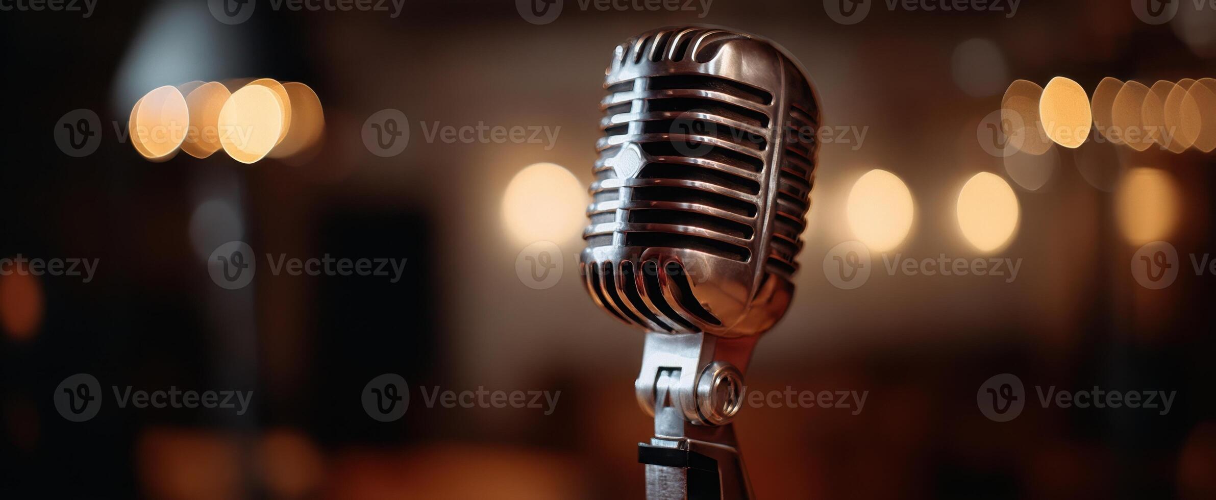 The microphone standing elegantly against a beautifully blurred background of lights. photo
