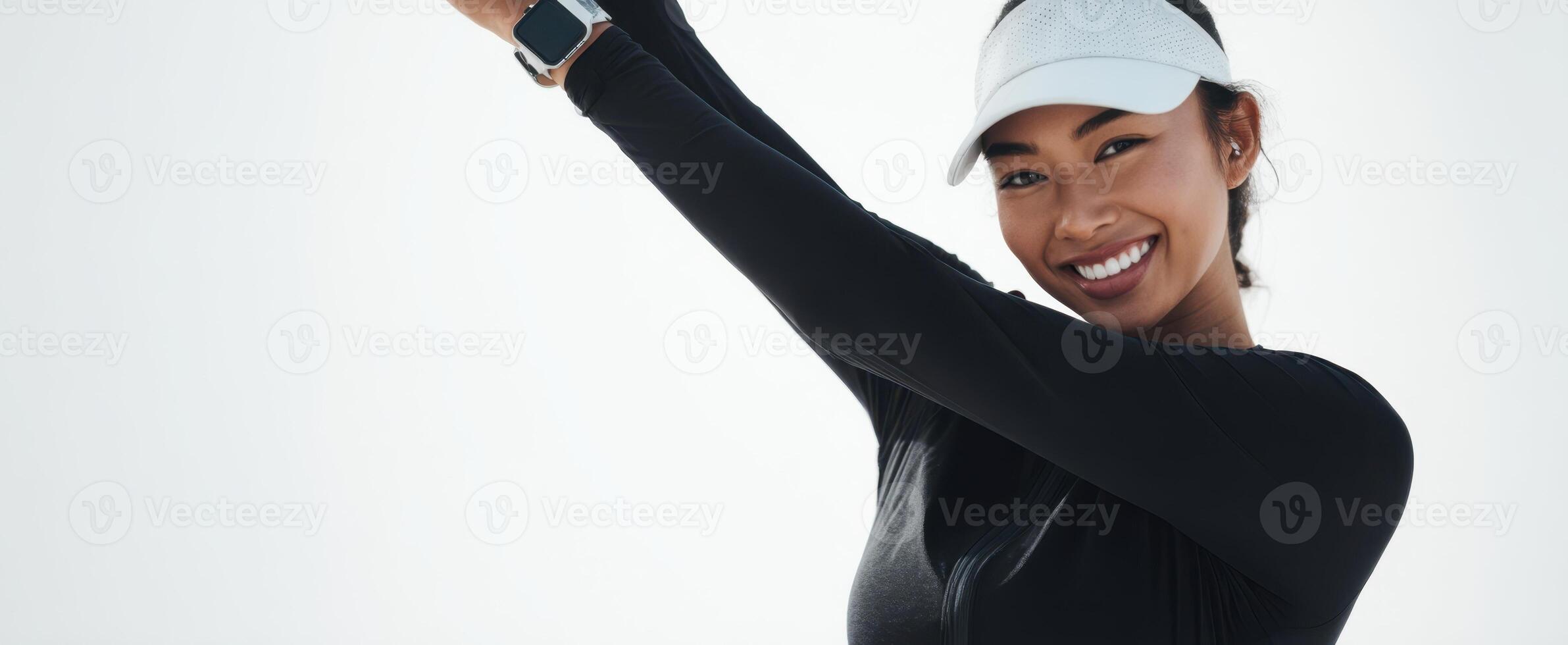 The smiling woman stretching joyfully in athletic attire outdoors. photo