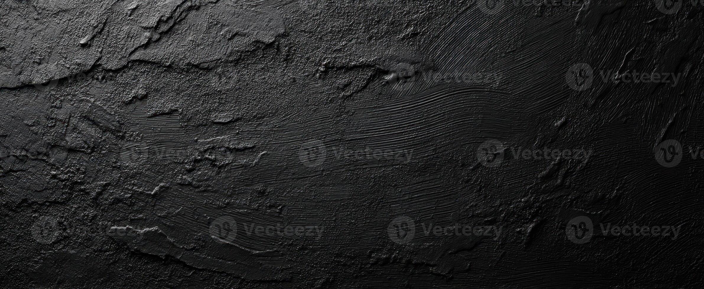 The textured black surface with a modern and abstract design. photo