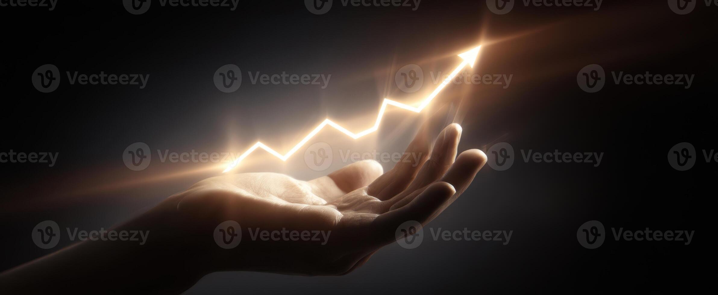 The hand illustrating growth with a glowing upward trend in a dark background. photo