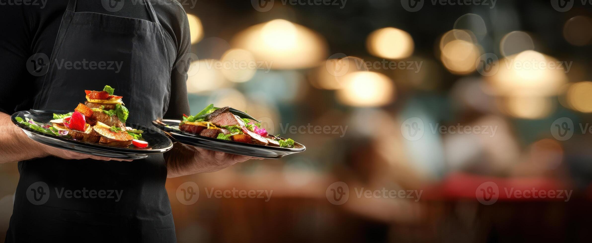 The waiter serves delicious gourmet meals in a vibrant restaurant setting. photo