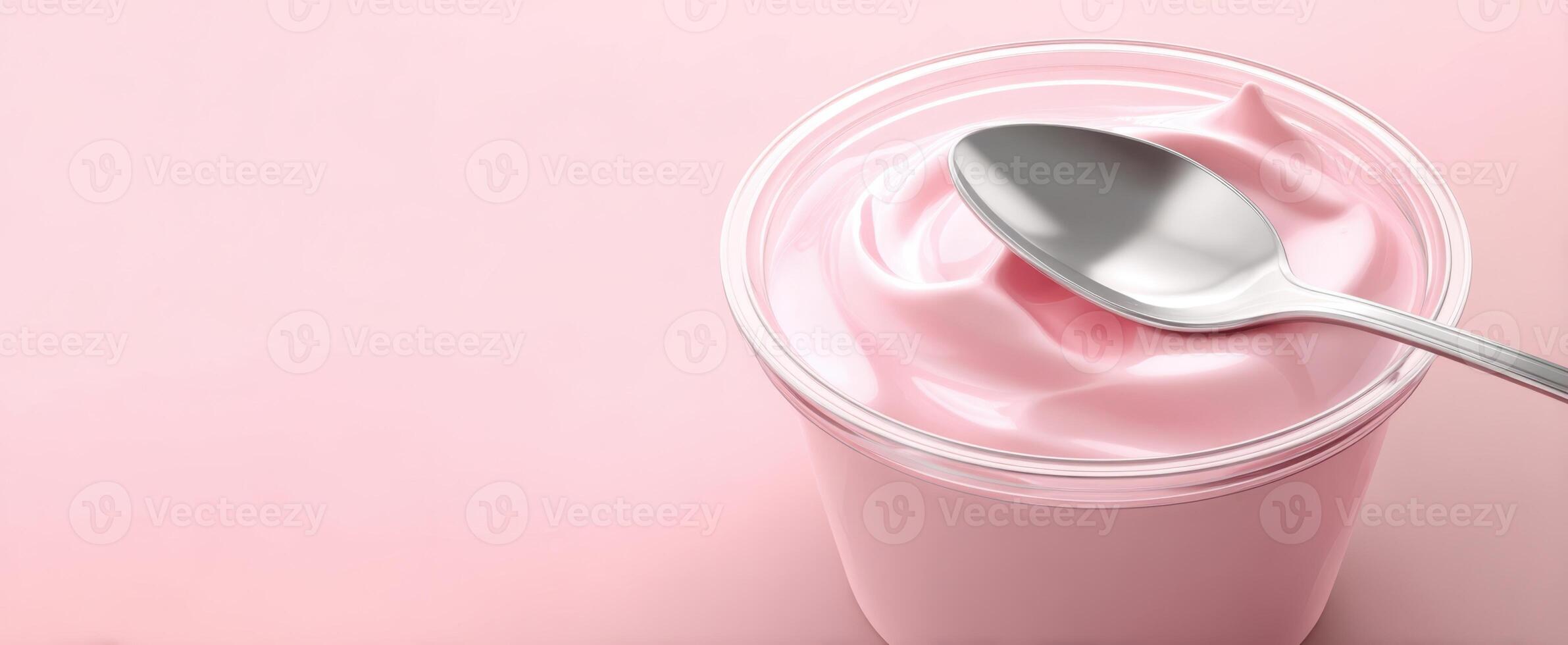 The creamy pink yogurt in a stylish bowl with a sleek spoon. photo