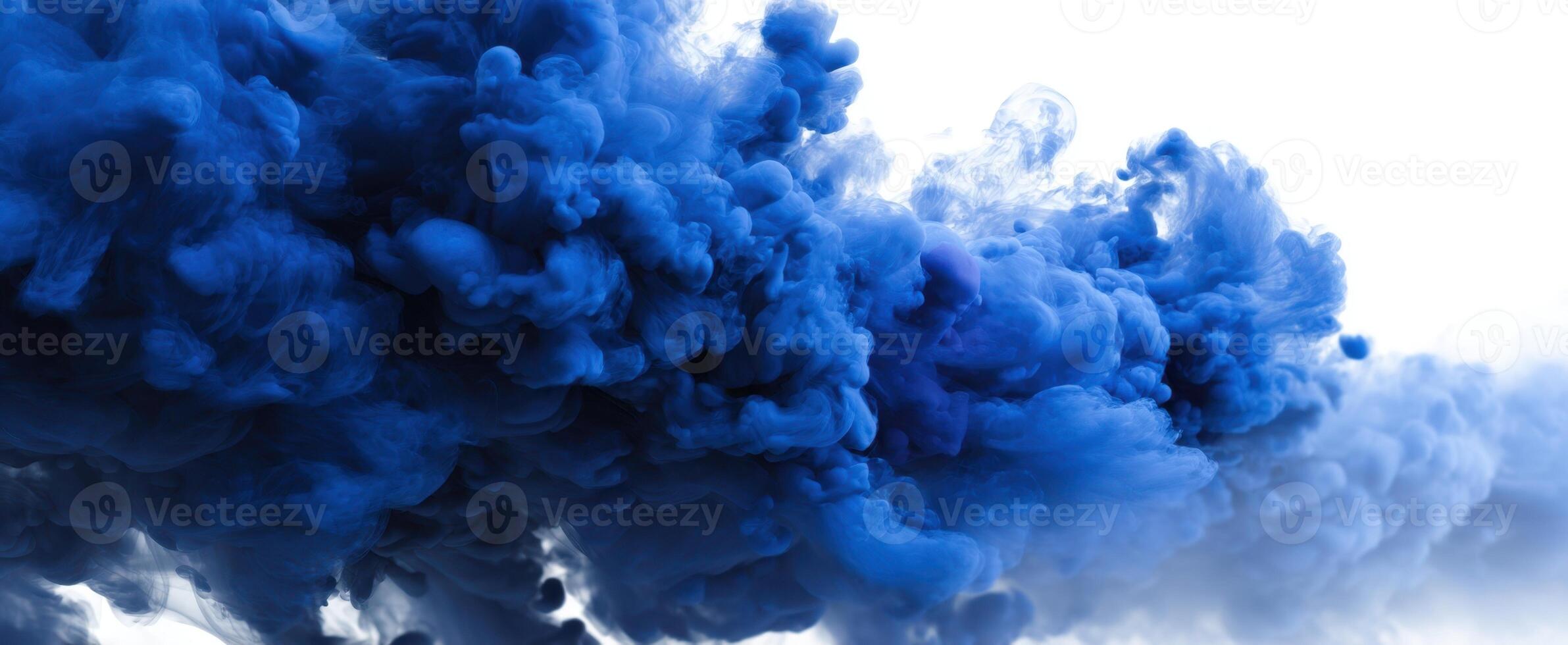 The blue smoke swirling dramatically in a serene abstract composition. photo