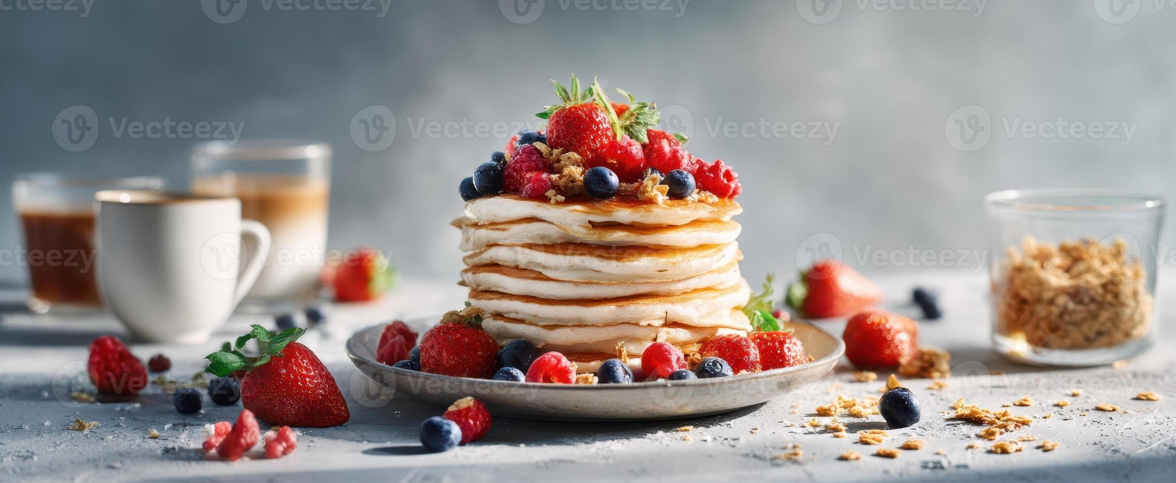 The mouthwatering stack of pancakes adorned with fresh berries and syrup. photo
