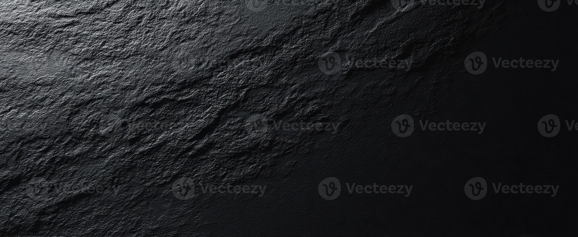 The textured black stone surface with intricate patterns and a modern aesthetic. photo