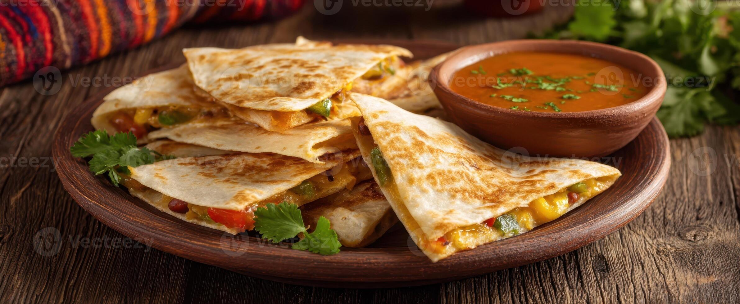 The delicious quesadilla served with a flavorful dipping sauce on a wooden plate. photo