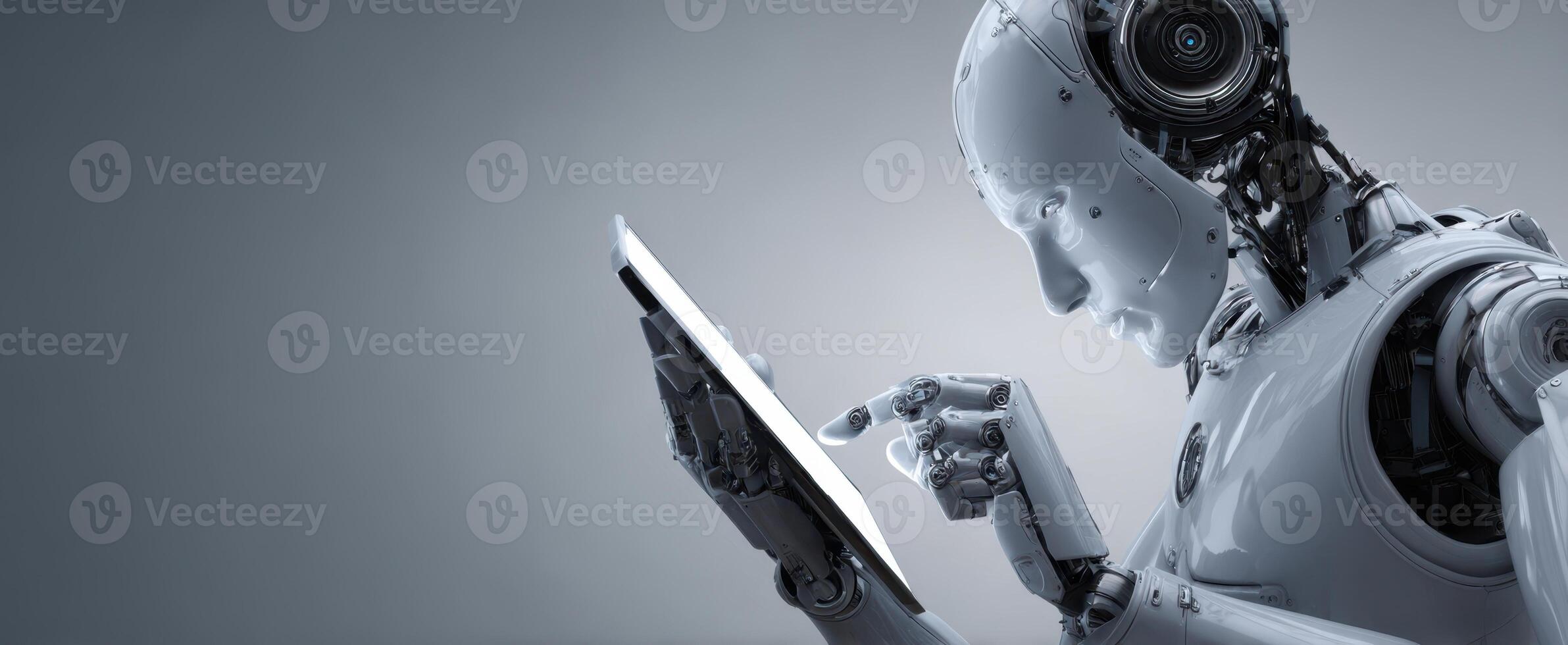 A robot holding a tablet computer in its hand photo