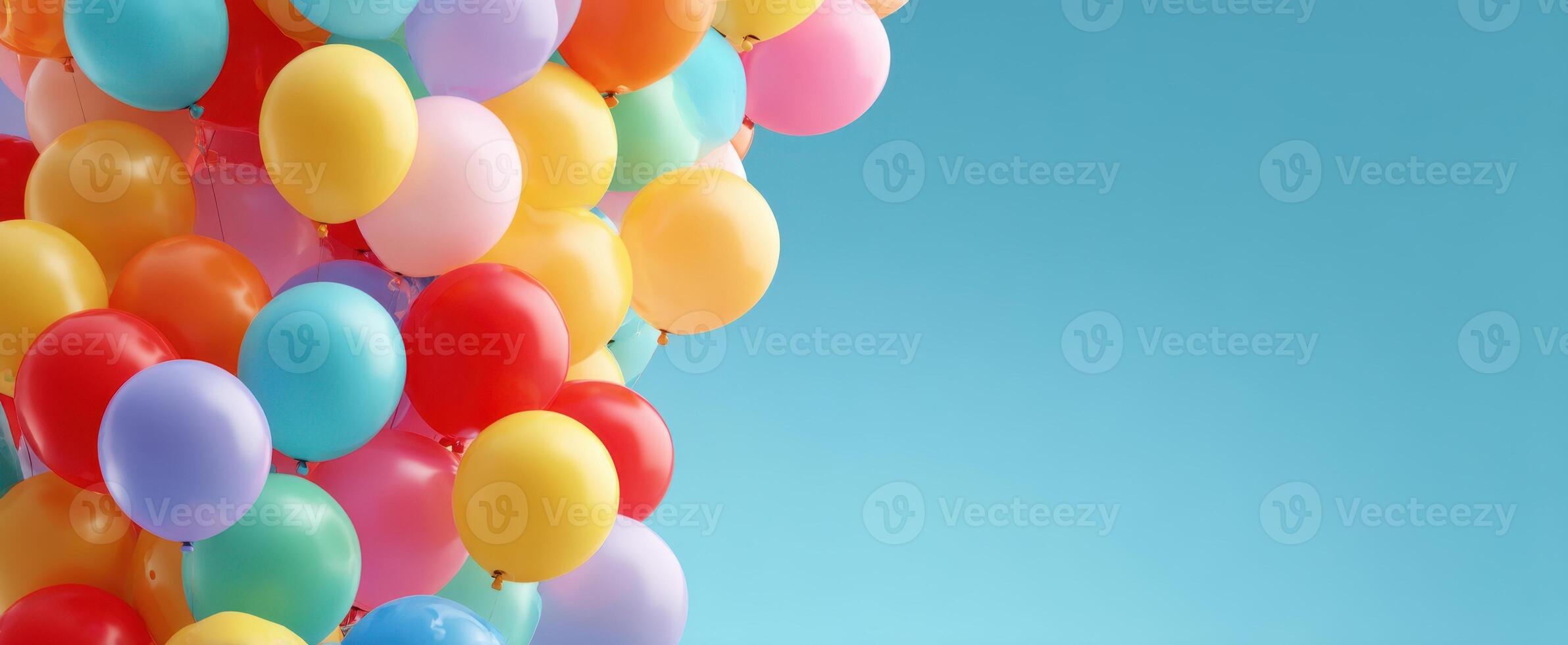 The Vibrant Array of Colorful Balloons Against a Clear Blue Sky photo