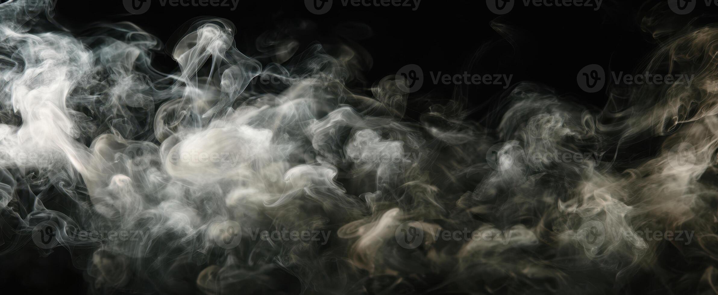 The swirling smoke creates an ethereal and mysterious atmosphere on a dark background. photo