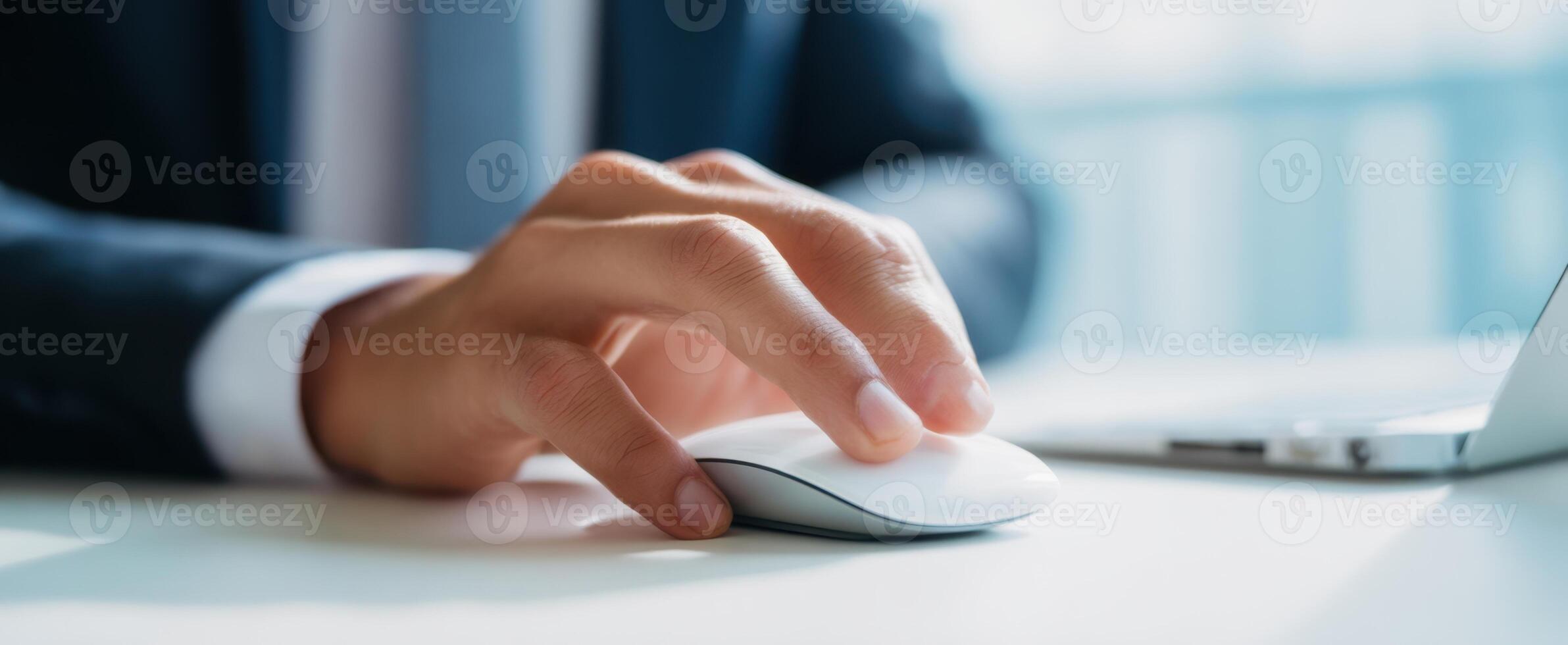 The Professional Hand Using a Computer Mouse in a Modern Workspace photo