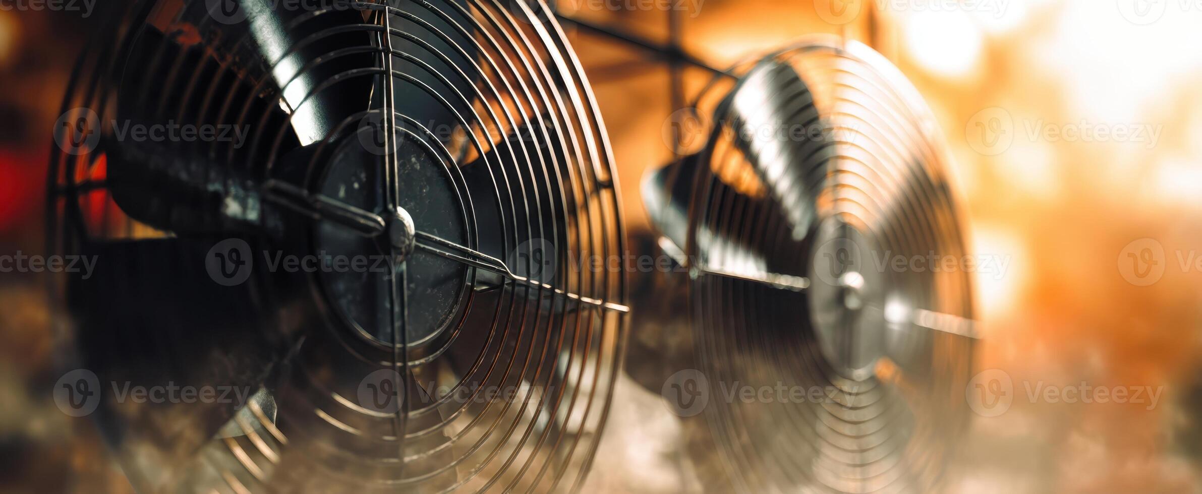 The industrial fans creating a cool breeze in a modern workspace photo