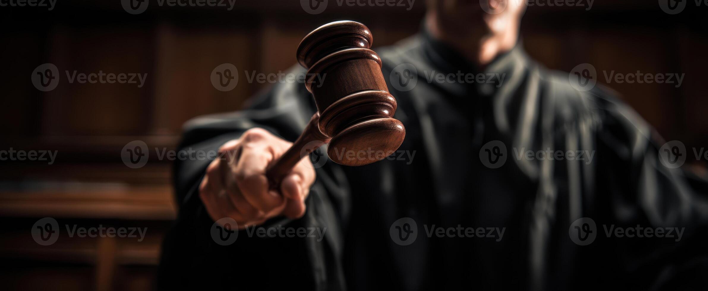 The Judge Holding the Gavel in a Serious Courtroom Setting photo