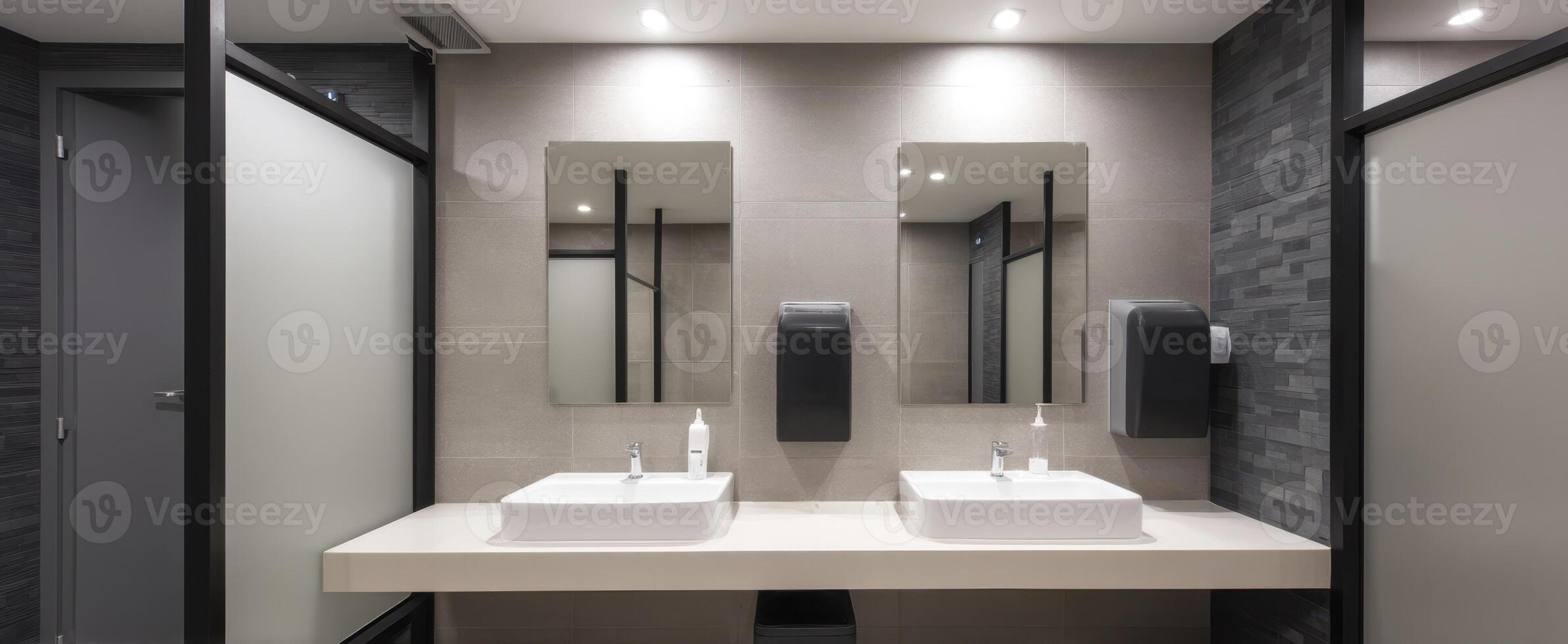 The modern bathroom featuring sleek sinks and contemporary mirrors. photo