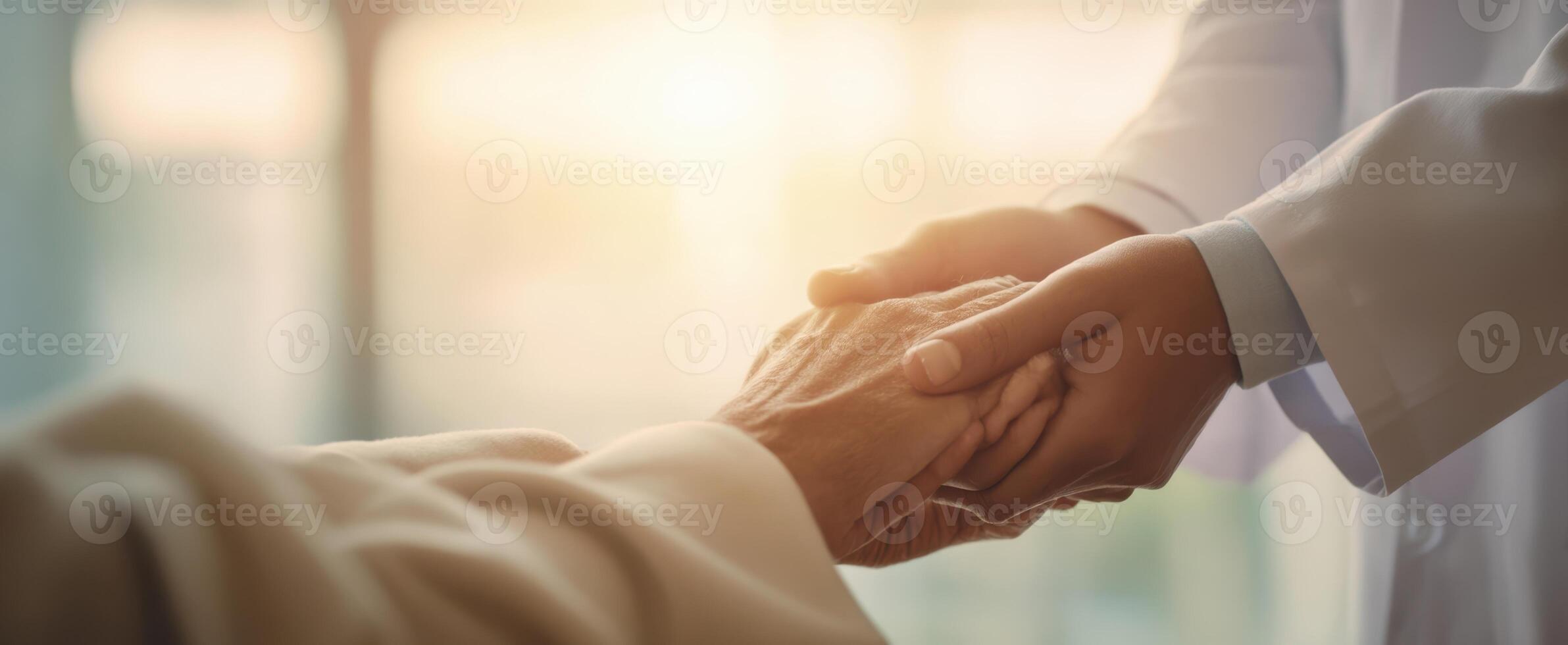 The compassionate touch between a doctor and an elderly patient in a warm setting. photo