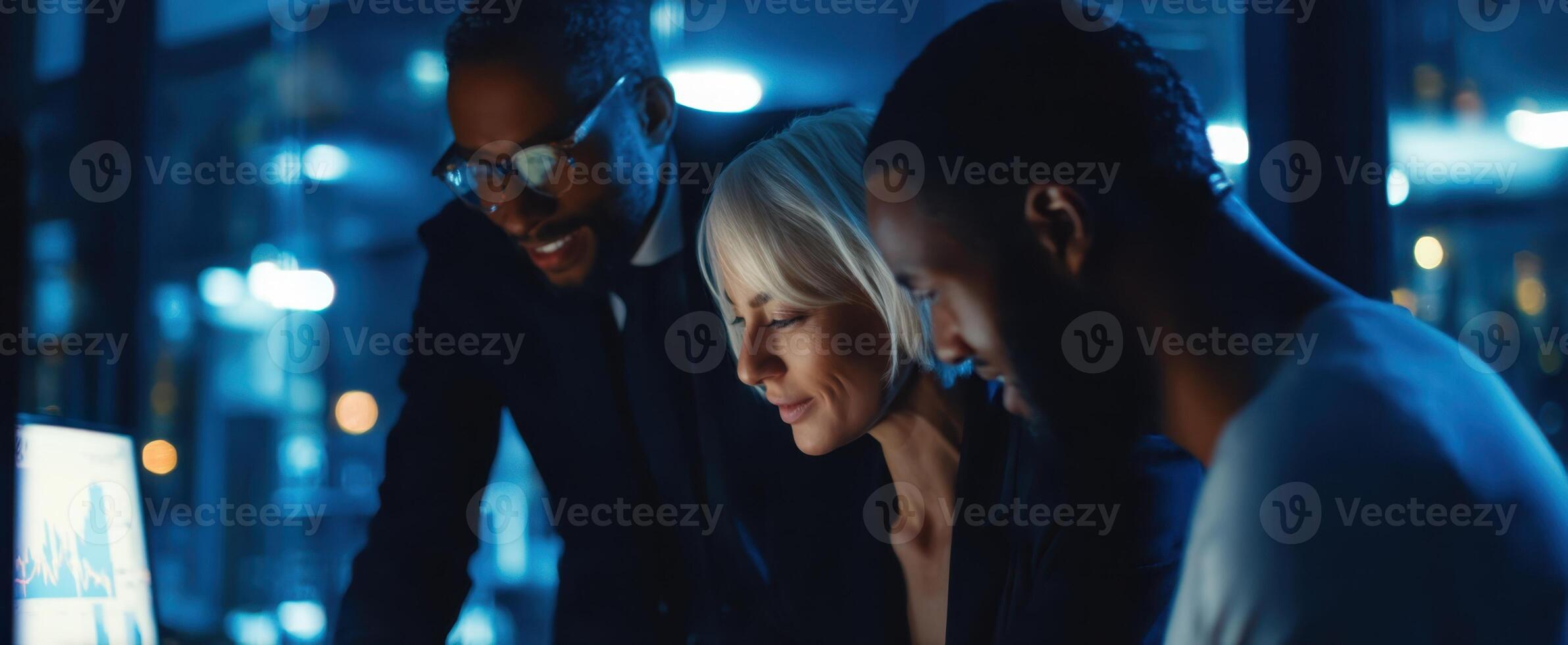 The professionals analyzing data together in a modern corporate workspace. photo