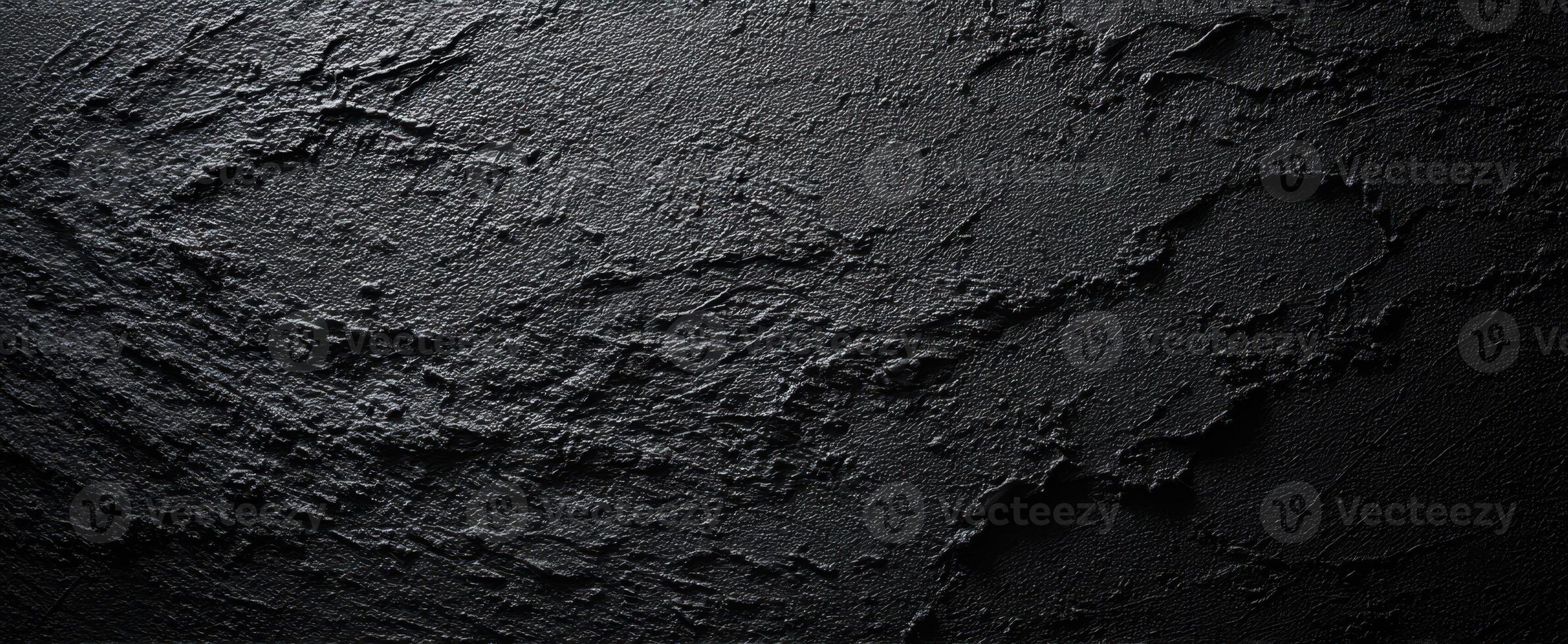 The textured black surface revealing depth and artistic character. photo