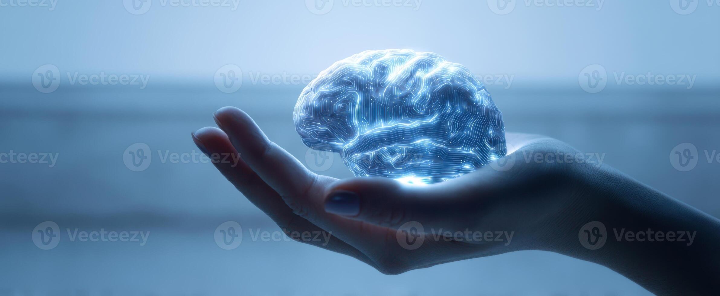 The glowing brain held delicately in a human hand representing innovation and technology. photo