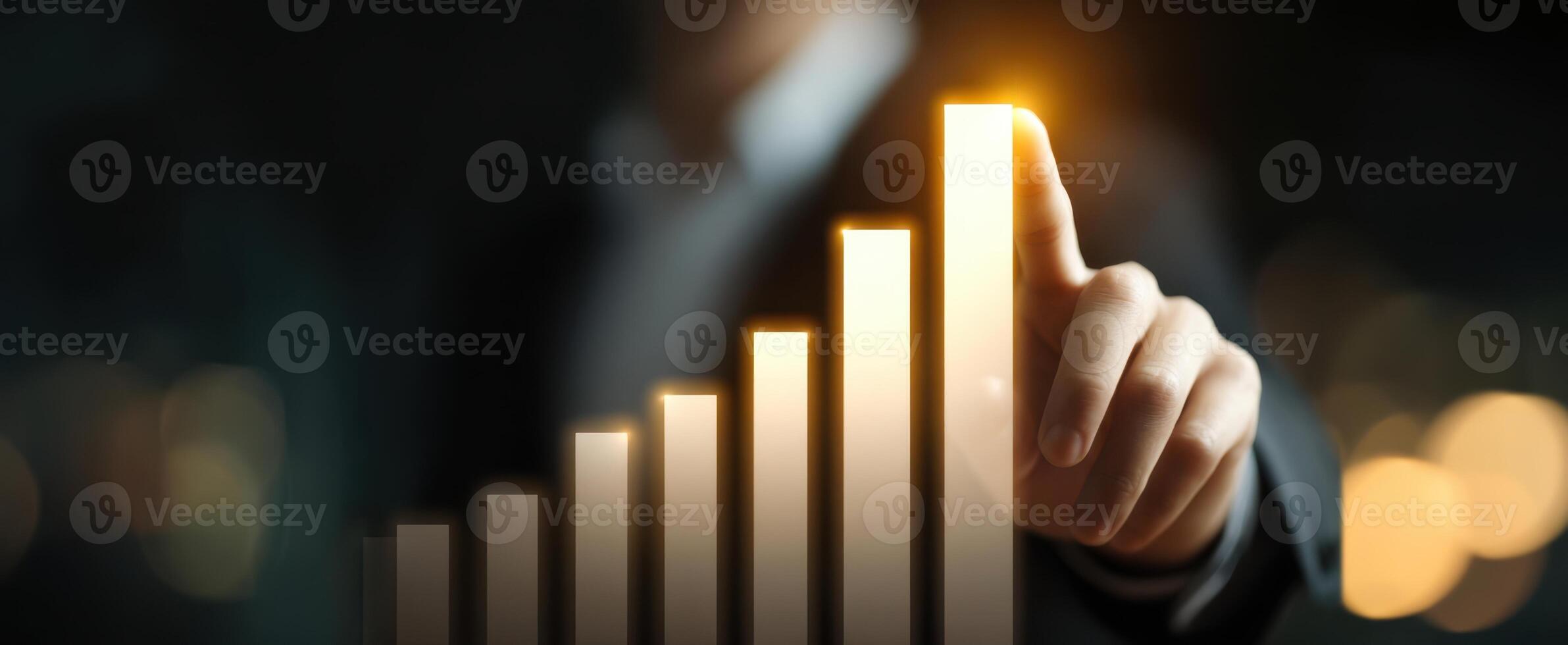 The businessman touching a glowing growth chart indicating success and progress. photo
