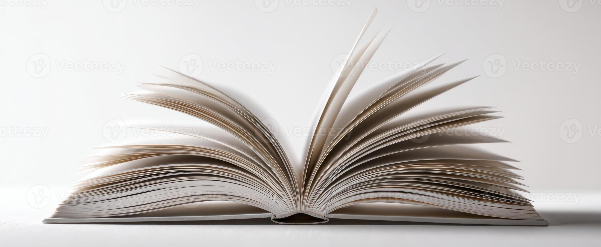 The open book showcasing its pages in an elegant presentation on a white background. photo