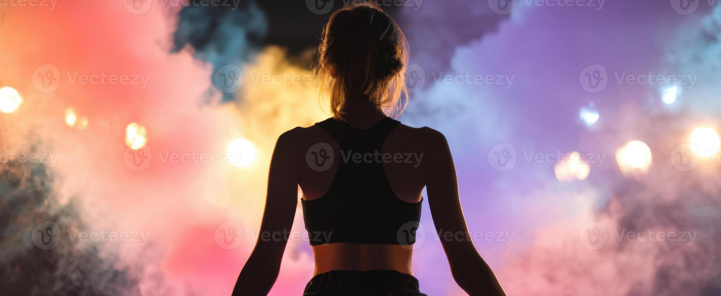 The woman embracing vibrant colors amid a captivating smoky backdrop photo